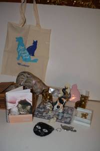 lot 280 image: Cat lot - brass cats, mousepad unopened, figurines, notepads, coin purse, PLUS Coldwater Creek pin