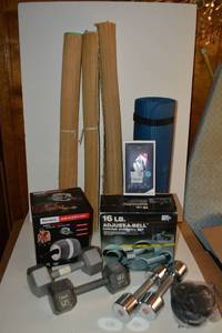 lot 242 image: Exercise lot - yoga mats, gloves, dumbbells, Ab-Carver, stretchy cord Some still in boxes.