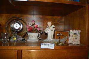 lot 286 image: This and that Lot - clock, teacup with flowers, angel figurine, candle snuffer and more
