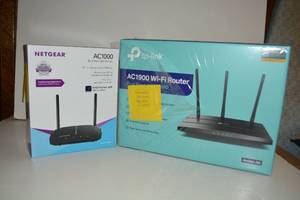 lot 297 image: Routers - appear unopened. Netgear AC1000, top-link AC1900
