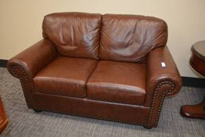 lot 2 image: Havertys Oversized Leather-like Brown Loveseat - 62W x 36D x 20 seat height