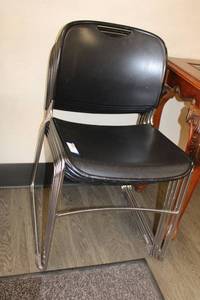 lot 15 image: Stackable black plastic chairs with chrome legs 5 Total
