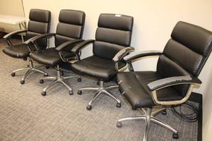 lot 18 image: (4) Black rolling office chairs with chrome base as shown