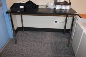 lot 29 image: Ikea Linnmon black table with adjustable legs - 29.5x59 top, legs adjust from 29.5 to 59H, Contents sold separately