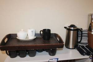 lot 46 image: Coffee Lot Coffee pot server, cream and sugar dishes, serving tray and (15) Paradiso Onyx Gibson coffee mugs