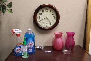 lot 88 image: Pink and clear glass vases, glass cleaner and wall clock as shown