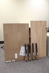 lot 111 image: Gerton IKEA Solid wood countertop only, Set of 4 adjustable legs, unopened Ikea Black table top, see pictures