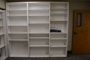 lot 161 image: White built-in wall bookshelf unit - 98W x 12.5D x 7.5ft. Tall - Bibles not included, bring tools and helpers to disassemble