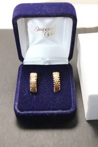 lot 111 image: Jewelry 14K yellow gold braided link hoop earrings. Huggie hoop design. Marked 14K. In Imperial Gold branded gift box.