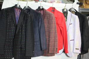 lot 46 image: Mens Clothes, see pictures  Bruno Conte multi-dot jacket M, Sean John 40R, Bruno Conte Maroon stripe jacket, Red shirt missing all buttons M 15-15.5, Purple Empire Jacket M, Black jacket feels like suede 40R