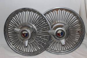 lot 10 image: Two Metal Spinner Hubcaps