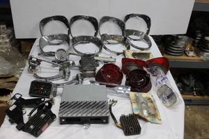 lot 200 image: Misc. Auto parts tail lights, door handles, regulator, Kawasaki and more