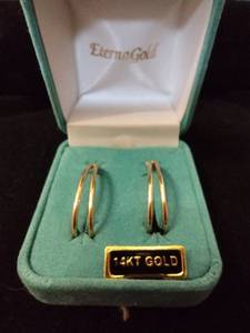 lot 115 image: Jewelry 14K yellow gold elongated hoop earrings. Marked 14K. In Eterna Gold presentation box