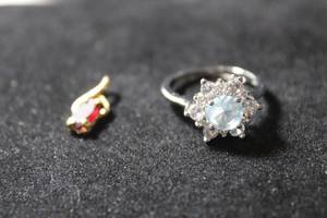 lot 209 image: Jewelry Sterling Silver gemstone cocktail ring. Marked 925. Size 8. Includes a gold tone Amethyst pendant. (tested)