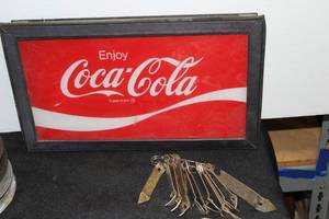 lot 331 image: Coca-Cola Glass Vending Machine Sign with metal frame and multiple bottle openers