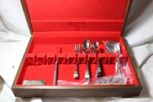 lot 214 image: Partial Silverware set with box - marked Wallace Sterling, Cake server and serving fork marked Vassar Nasco.Stainless Japan
