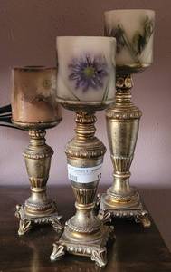 lot 12 image: SET OF 3 CANDLE HOLDERS WITH CANDLES IN STYLEDESIGNCOLOR SHOWN. FROM 12 TO 15 HIGH.