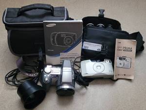 lot 48 image: SONY AND CANON CAMERAS WITH ACCESSORIES AS SHOWN.
