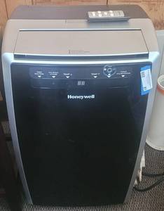 lot 81 image: HONEYWELL PORTABLE AC MODEL MN10CES AS SHOWN.