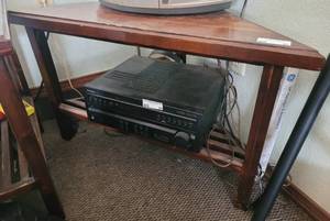 lot 91 image: CORNER WOOD TABLE AS SHOWN. APPROX. 37X 23 CONTENTS NOT INCLUDED.
