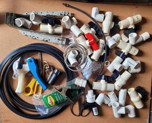 lot 180 image: LOT OF PLUMBING PARTS AND MORE AS SHOWN.