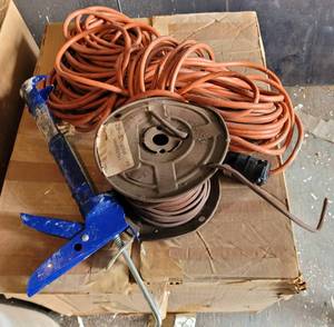 lot 201 image: EXTENSION CORD AND MORE AS SHOWN.