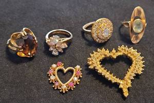 lot 244 image: ASSORTED RINGS AND PENDANTS AS SHOWN.