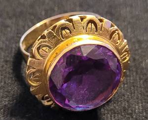 lot 256 image: RING WITH PURPLE STONE AS SHOWN.