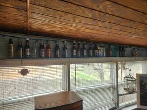 lot 111 image: Selection of collectible soda bottles and bar jars