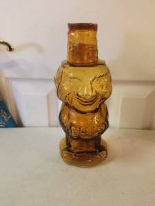 lot 204 image: Vintage Tiara Amber glass W C Fields Mountaineer Man decanter