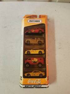 lot 183 image: Coca-Cola Matchbox 164 die cast set of 5