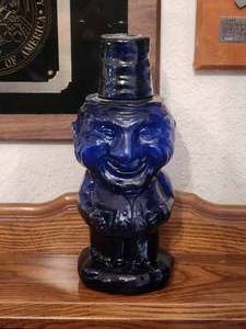 lot 219 image: Vintage Tiara Blue glass W C Fields Mountaineer Man decanter
