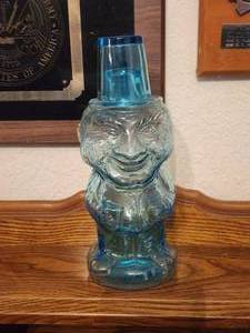 lot 225 image: Vintage Tiara light Blue glass W C Fields Mountaineer Man decanter