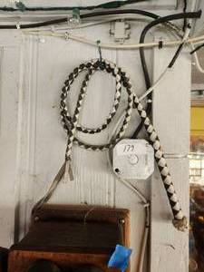 lot 179 image: Black and white leather bullwhip