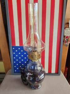 lot 195 image: Vintage oil lamp with globe converted to electric