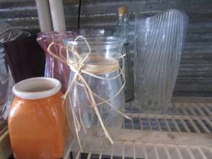 lot 35 image: lot of clear glass vases, pink vase, blue and white vase and more