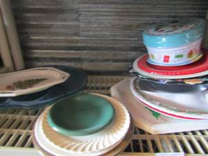 lot 36 image: plastic Christmas and Halloween platters, trays and bowls, also has 3 glass dinner plates and 1 saucer