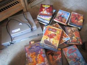 lot 42 image: cyberhome dvd player, with various dvd kid movies scooby doo, spiderman, lion king, lady and the tramp and more Don�t know if all DVDs are there