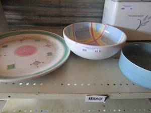 lot 62 image: Oval multi color platter by caleca has a small chip, comes with a matching large salad bowl,crate and barrel blue serving bowl