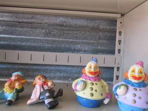 lot 78 image: 2 handmade clown piggy banks and 2 handmade clowns one is eating other is playing violen