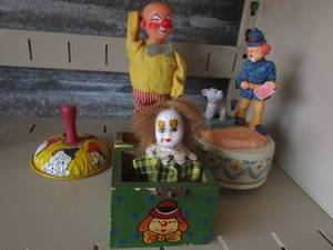 lot 80 image: apex quality musical police clown,plastic wind up clown, glass clown jack in the box