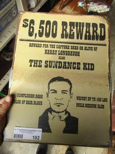 lot 102 image: metal sign it says 6,500 reward for harry longbaugh the sundance kid