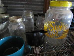 lot 131 image: sun tea jar, various mason jars with and without lids and a large green coffee cup