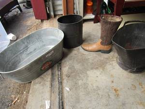 lot 144 image: 12 in ceramic cowboy boot, small black waste basket, one handled watering bucket, silver doubled handled behrens galvanized hot dipped oval tub