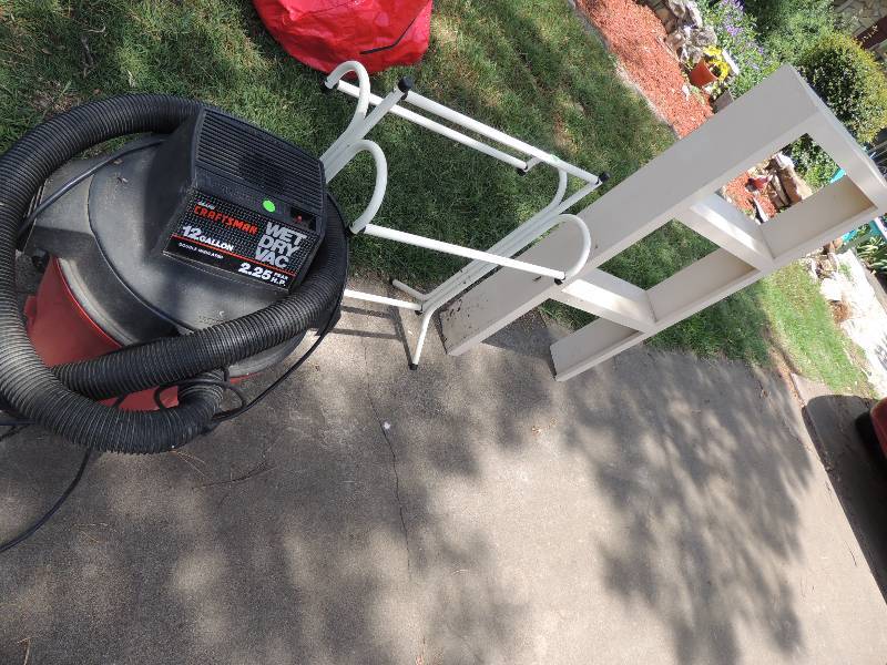 lot 311 image: wet dry vacuum, quilt rack, and lig...
