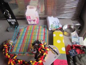 lot 106 image: Drink up beer opener, multi color basket, new dog toy, new dog large size jacket, larger pencil for dcor and more