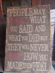 lot 10 image: 3624 Wall art made out of wood and burlow it says-- People may forget what you said and what you did but the will never forget how you made them feel