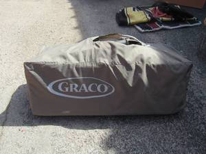 lot 19 image: Graco pack n play with buily in basinet top part, unknown if all parts are  in bag