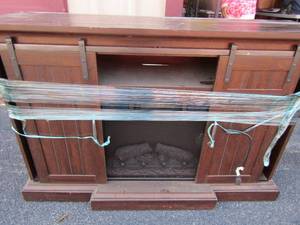 lot 26 image: Wooden fireplaceHeater tv stand , cabinets 36x54x16 twin star international