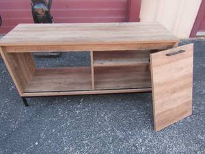 lot 43 image: Wooden entertainment center door needs repaired 23x43x16